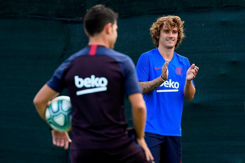 Barcelona's French forward Antoine Griezmann claps during a training session with his new teammates. AFP
