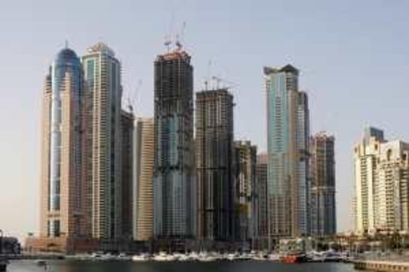 Dubai, 22nd June 2009.  The Torch (red colour on top) still under construction, amongst the skyscrapers at the Dubai Marina.  (Jeffrey E Biteng / The National)  *** Local Caption ***  JB06-Torch.jpg