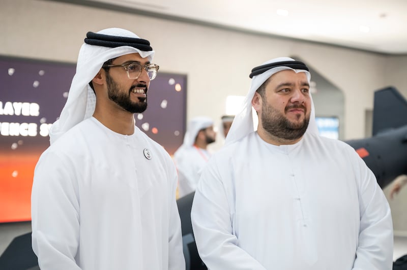 Sheikh Zayed bin Hamdan, left, and Mohamed Hassan Al Suwaidi, chief executive of Abu Dhabi Developmental Holding Company, tour the airshow.