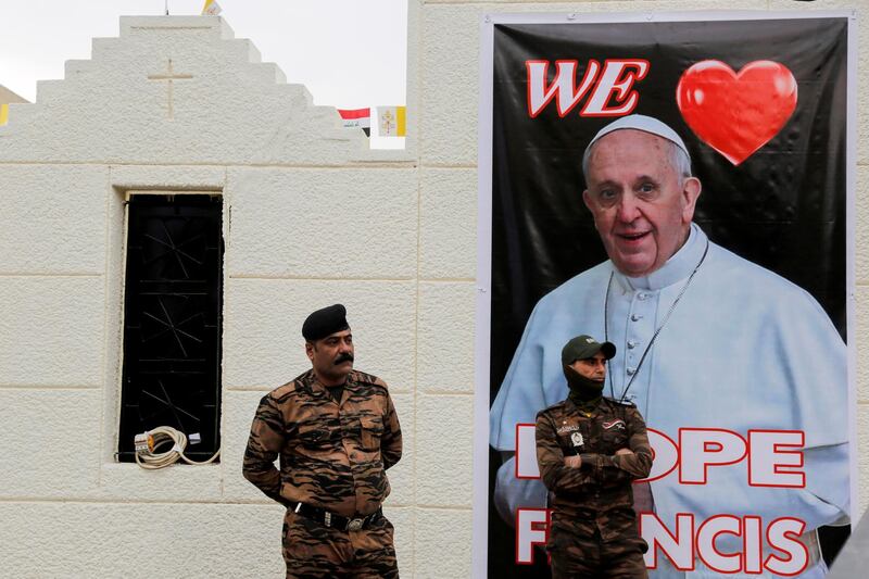 Members of the Iraqi security forces stand guard ahead of the planned visit of Pope Francis to Iraq, in Baghdad, Iraq March 4, 2021. REUTERS/Teba Sadiq