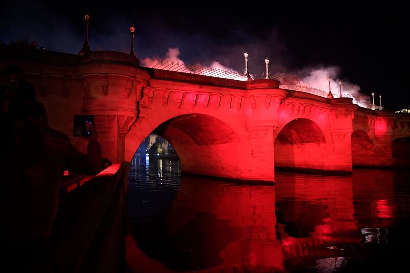 The Pont Neuf bridge is illuminated in red to commemorate the brutal repression of a1961 demonstration by Algerians. AFP