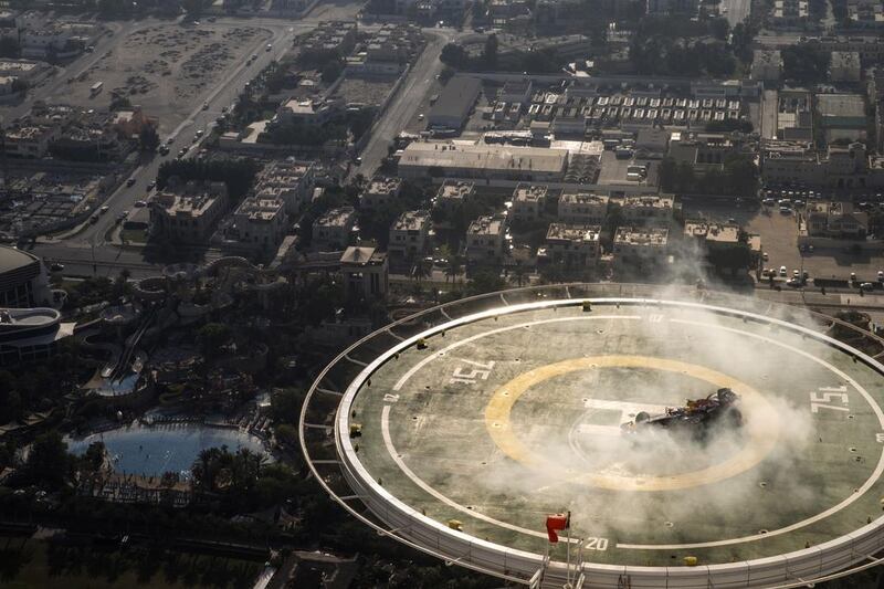 David Coulthard of Scotland performs in a Red Bull Racing Formula One car on the helipad of the Burj Al Arab hotel in Dubai. Samo Vidic/Red Bull Content Pool 