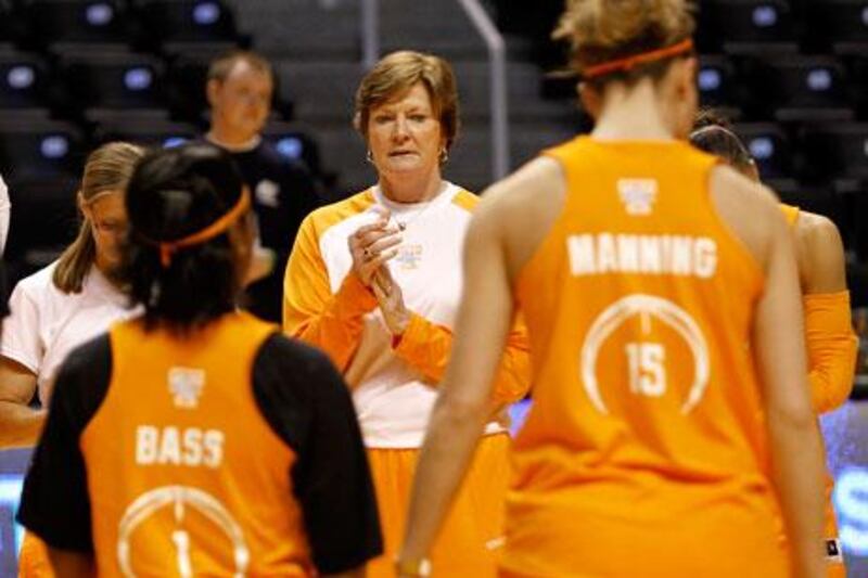 Pat Summitt, centre, the University of Tennessee's women's basketball coach, knew something was wrong when, during a time out she had called, she forgot what offensive set she wanted to the team to play.