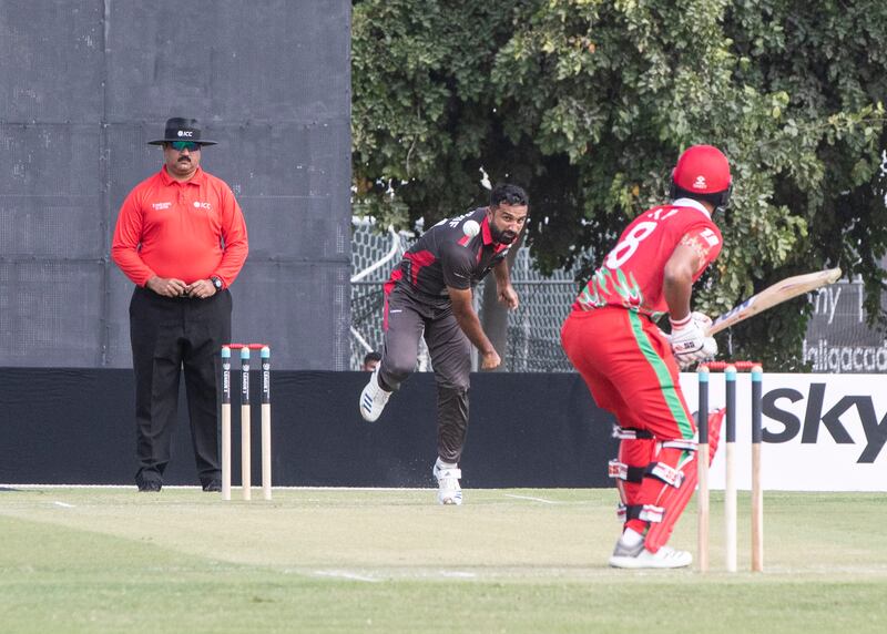 UAE's Kashif Daud bowls to Oman's Kashyupkumar Prajapati during the Cricket World Cup League 2 match at the ICC Academy in Dubai. 