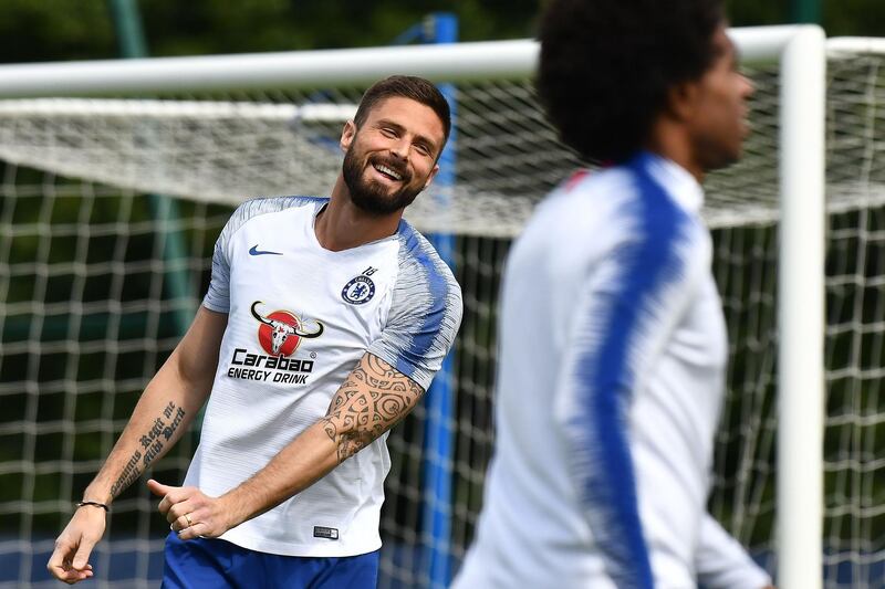 Chelsea's French striker Olivier Giroud shares a joke during training. AFP