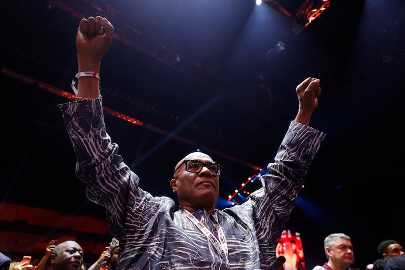 Anthony Joshua's father Robert cheers on his son from ringside. Reuters