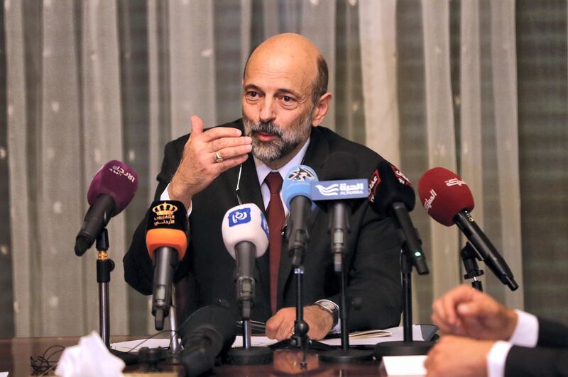 The newly appointed Jordanian Prime Minister Omar al-Razzaz meets with member of Union leaders in Amman, on June 7, 2018. 
Al-Razzaz said that a deal has been reached to withdraw a proposed income tax law that has sparked a week of angry protests. "An agreement has been found to withdraw the bill," Razzaz told journalists after meeting legislators, without setting a firm date for parliament to send the legislation back to the government. 
 / AFP PHOTO / Ahmad GHARABLI