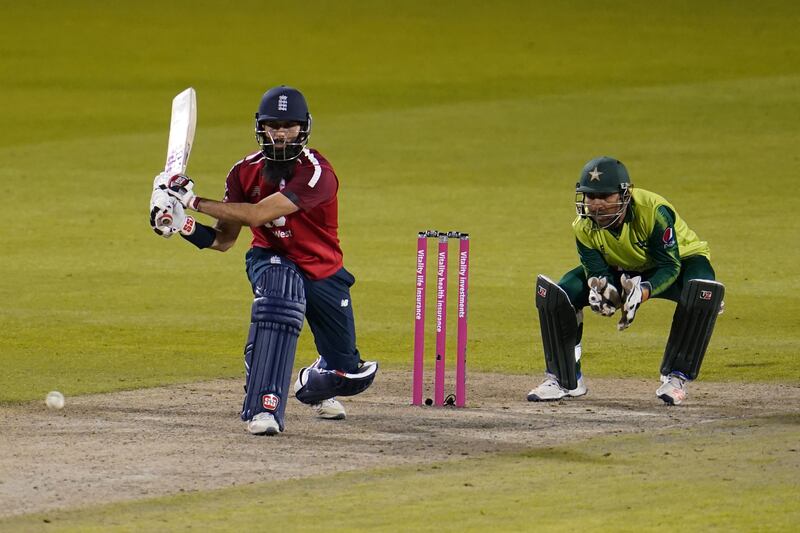 England's Moeen Ali (L) bats away from Pakistan's Sarfaraz Ahmed during the international Twenty20 cricket match between England and Pakistan at Old Trafford cricket ground in Manchester, north-west England, on September 1, 2020. (Photo by Jon Super / POOL / AFP) / RESTRICTED TO EDITORIAL USE. NO ASSOCIATION WITH DIRECT COMPETITOR OF SPONSOR, PARTNER, OR SUPPLIER OF THE ECB