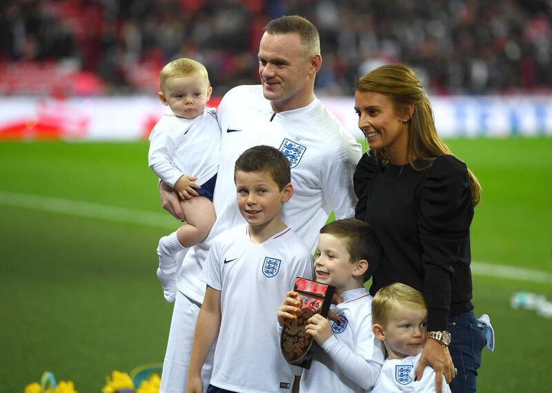 Wayne Rooney of England, his wife Coleen Rooney and their children Kit Joseph Ronney, Klay Anthony Rooney, Kai Wayne Rooney and Cass Mac Rooney pose for a photo pitside prior to the International Friendly match between England and United States at Wembley Stadium in London, United Kingdom.  Getty Images