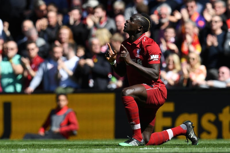 Liverpool's Senegalese striker Sadio Mane celebrates scoring the opening goal during the English Premier League football match between Liverpool and Wolverhampton Wanderers at Anfield in Liverpool, north west England on May 12, 2019. (Photo by Paul ELLIS / AFP) / RESTRICTED TO EDITORIAL USE. No use with unauthorized audio, video, data, fixture lists, club/league logos or 'live' services. Online in-match use limited to 120 images. An additional 40 images may be used in extra time. No video emulation. Social media in-match use limited to 120 images. An additional 40 images may be used in extra time. No use in betting publications, games or single club/league/player publications. / 