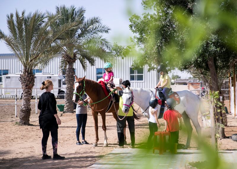 ABU DHABI, UNITED ARAB EMIRATES. 18 MARCH 2020.
Children riding horses in Al Samha with Ride to Rescue project.

Yasmin Sayyed runs Ride to Rescue. She has taken in 17 rescued horses who would normally be euthanized, and she tries to offset the cost of their care by offering the public healing sessions where they ride or walk with them. 

(Photo: Reem Mohammed/The National)

Reporter:
Section: