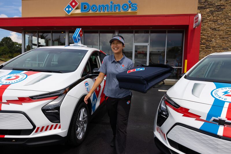 More than 100 Domino's branded Chevy Bolt EVs are already on the road.