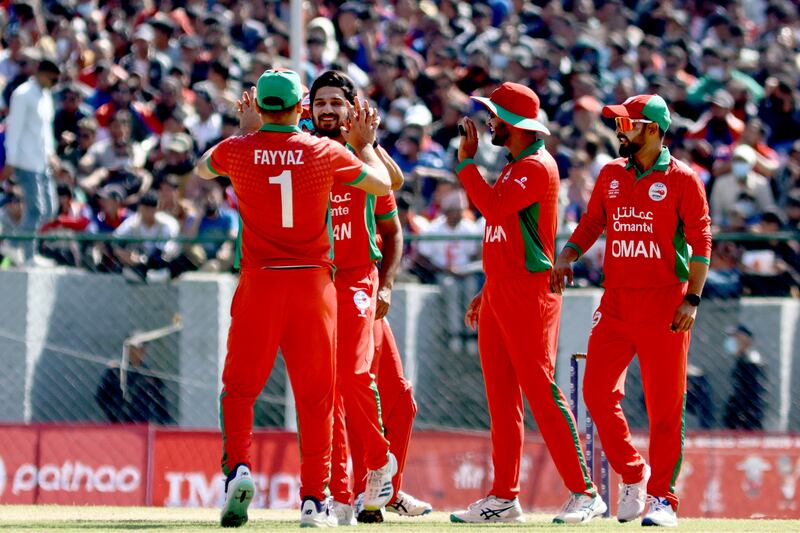 Aqib Ilyas celebrates taking a wicket for Oman during the T20 World Cup Asia Qualifier final against Nepal. Subas Humagain for The National