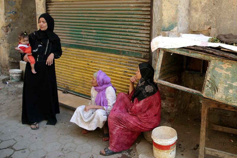 epa06259168 Egyptian women sit in front of their homes at the Maspero Triangle slum, Cairo, Egypt, 11 October 2017. Egypt's government will begin in mid October 2017 demolishing homes vacated by residents in the lower-income area in central Cairo known as the Maspero Triangle to make way for a project to develop the area into an investment and residential hub  EPA/KHALED ELFIQI