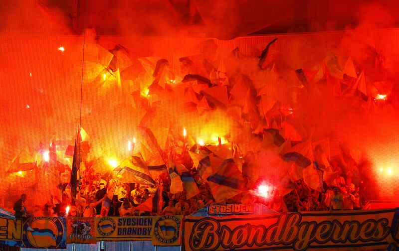 Brondby fans let off flares inside the Groupama Stadium before their Europa League match against Lyon on Thursday, September 30. Reuters