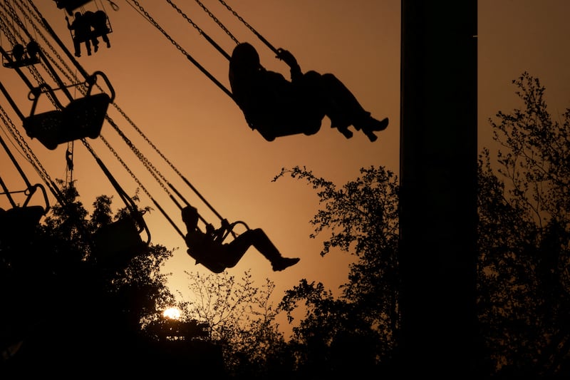 Baghdad residents take a ride at an amusement park at sunset, as they celebrate Eid Al Adha in Iraq's capital. Reuters