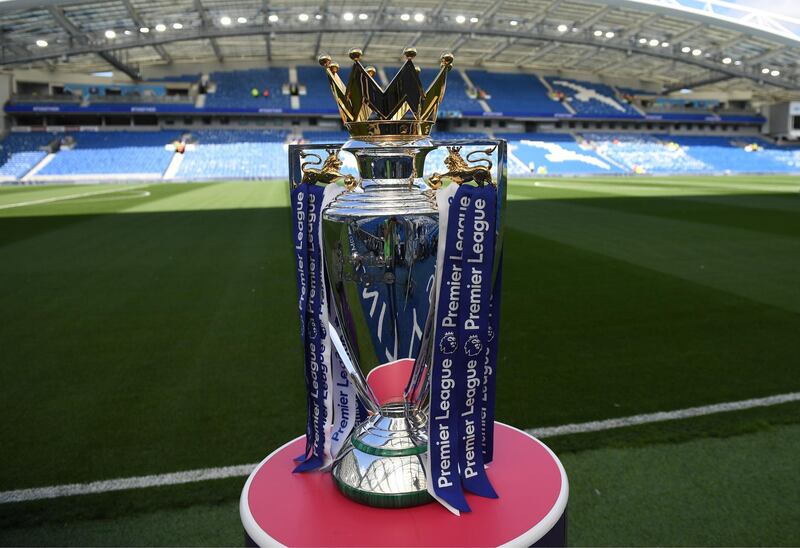 (FILES) In this file photo taken on August 12, 2017 The Premier league trophy sits beside the pitch ahead of the English Premier League football match between Brighton and Hove Albion and Manchester City at the American Express Community Stadium in Brighton. Premier League clubs will ask players to take a combination of pay cuts and deferrals amounting to 30 percent of their salary due to the financial crisis caused by coronavirus, the league said in a statement on April 3, 2020. - RESTRICTED TO EDITORIAL USE. No use with unauthorized audio, video, data, fixture lists, club/league logos or 'live' services. Online in-match use limited to 75 images, no video emulation. No use in betting, games or single club/league/player publications. 
 / AFP / CHRIS J RATCLIFFE / RESTRICTED TO EDITORIAL USE. No use with unauthorized audio, video, data, fixture lists, club/league logos or 'live' services. Online in-match use limited to 75 images, no video emulation. No use in betting, games or single club/league/player publications. 
