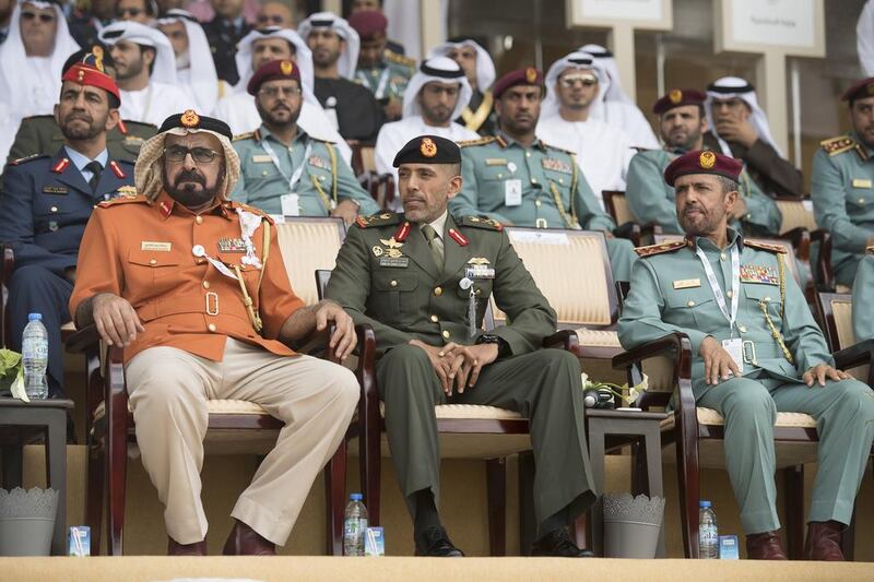 Major General Abdullah Muhair Al Ketbi, left, and Major General Pilot Sheikh Ahmed bin Tahnoon bin Mohamed Al Nahyan, Chairman of the UAE National and Reserve Service Authority, centre, attend the 2017 International Defence Exhibition and Conference opening ceremony. Hamad Al Kaabi / Crown Prince Court - Abu Dhabi