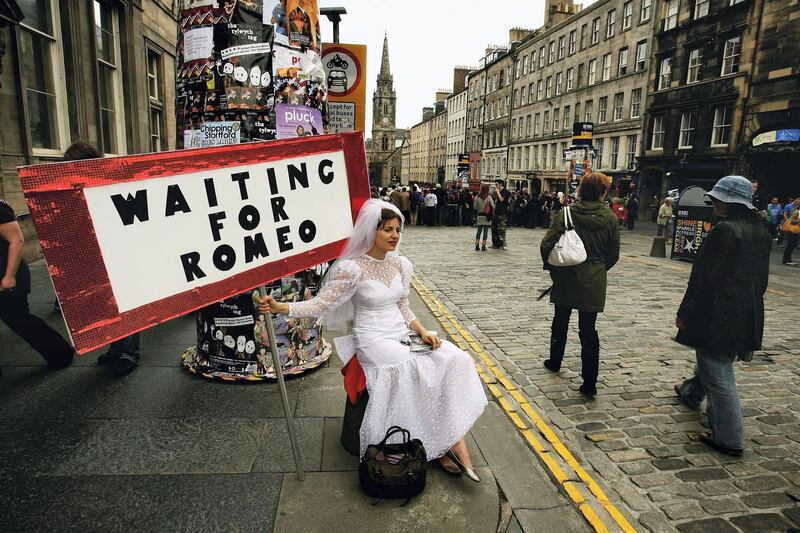 EDINBURGH, UNITED KINGDOM - AUGUST 23:  Street entertainers perform on the Royal Mile as part of the Fringe during the Edinburgh Festival on August 23, 2006 in Edinburgh, Scotland.  (Photo by Jeff J Mitchell/Getty Images)