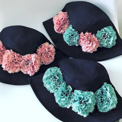 Bucket hats with floral brims by Chloe Bosher are available at Tania's Teahouse in Dubai 