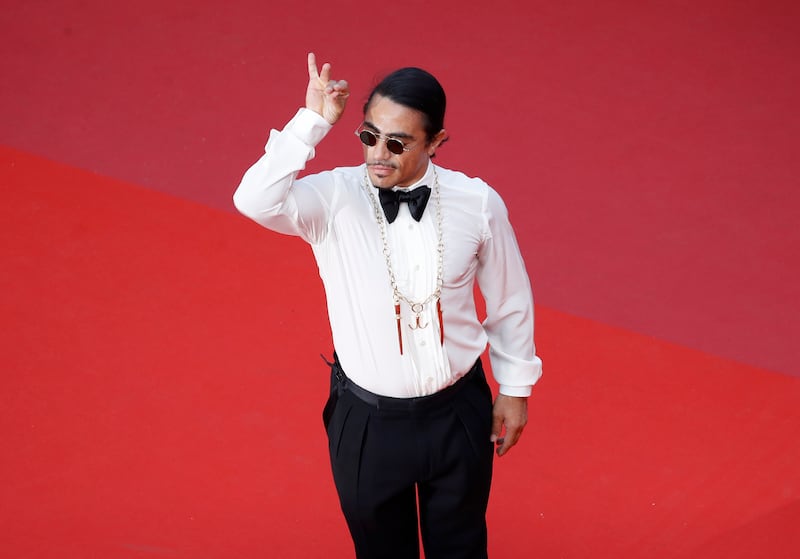 Nusret Gokce, known to millions of people on social media as 'Salt Bae', welcomed General To Lam to his restaurant in Knightsbridge, London. Getty Images