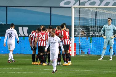 Athletic Bilbao players celebrate with Raul Garcia after the first goal as Real Madrid captain Sergio Ramos walks away. Reuters