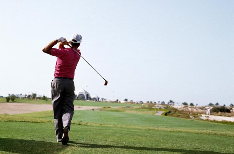 Mark James of England plays his tee shot at the par-4 16th hole during the final round of the 1989 Dubai Desert Classic at the Emirates Golf Club on March 5, 1989 in Dubai. David Cannon / Getty Images