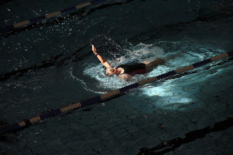 People swim in the indoor swimming pool at the re-opened The Pods sports and fitness centre in Scunthorpe, north east England. AFP