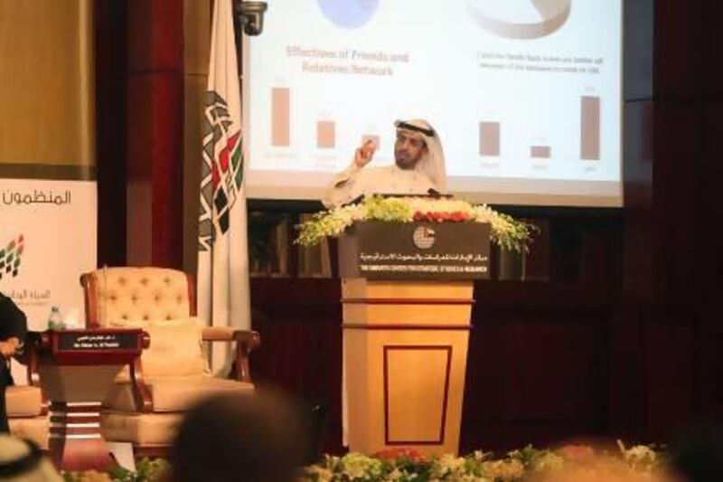 Dr Omar Al Nuaimi, assistant professor for business and economics at UAE University, at the conference. He said that at least 70 per cent of workers had claimed their skills had improved while in the UAE and 40 per cent were able to save money in the first six months. Fatima Al Marzooqi / The National