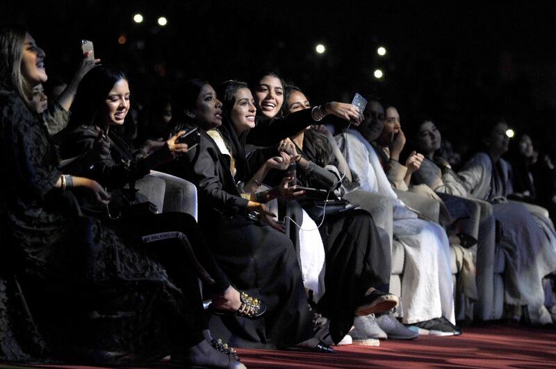 Saudi women take selfies as they attend a concert by Egyptian pop sensation Tamer Hosny in Jeddah on March 30, 2018. Thousands of fans were taken by surprise when tickets for Hosny's first-ever Saudi concert came with the edict that dancing was "strictly prohibited". Amer Hilabi / AFP