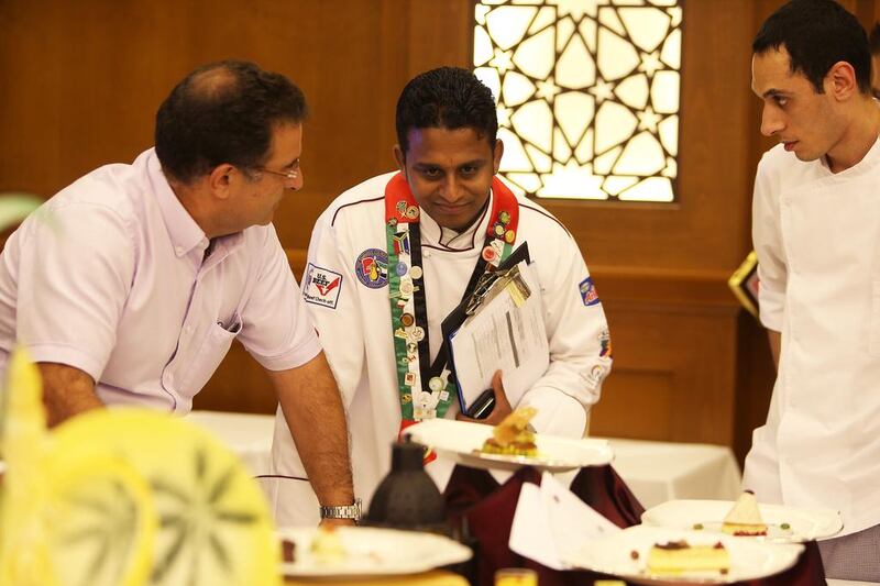 K. A. C Prasad, Executive Chef of Miramar hotel (centre) in the East Coast Culinary Competition held at Miramar Al Aqah Beach Resort in Fujairah. Pawan Singh / The National  