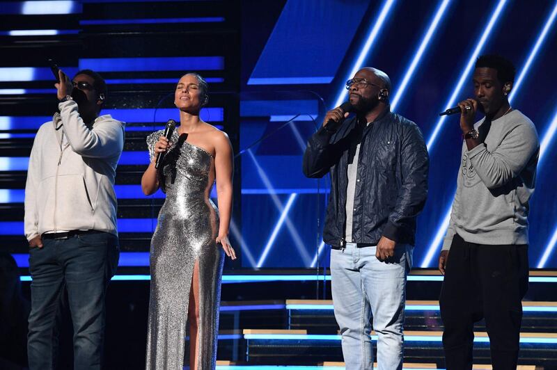 Host Alicia Keys (2nd L) and Boyz II Men sing in honour of late NBA legend Kobe Bryant during the 62nd Annual Grammy Awards on January 26, 2020, in Los Angeles.  AFP