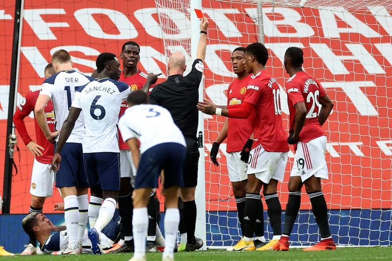 Referee Anthony Taylor shows a red card to United's Anthony Martial, third from right. AP