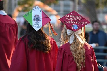 Students graduating from college. AFP