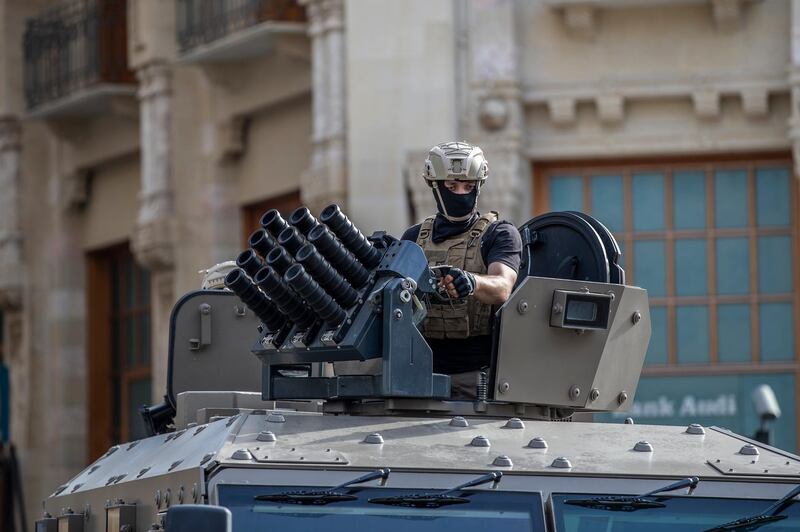 Lebanese Riot police officers sits on his armored vehicle during clashes with anti-government protesters during a mass protest against the economic and financial crisis, and to demand early parliamentary elections, in Beirut, Lebanon.  EPA