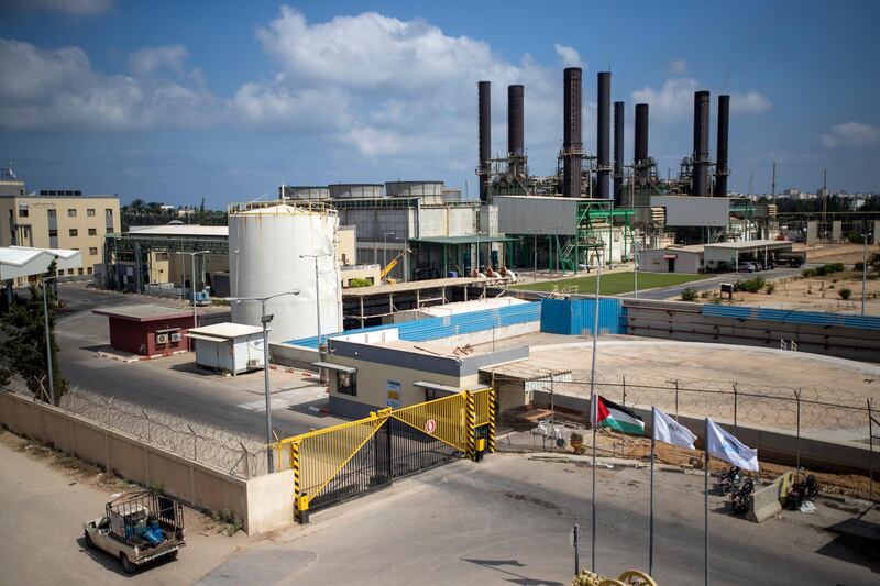 A car drives next to Gaza's power plant after it was shutdown according to Gaza's Hamas officials, in the town of Nusairat, central Gaza Strip, Tuesday, Aug. 18, 2020.(AP Photo/ Khalil Hamra)