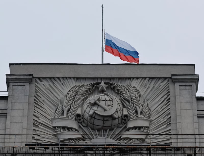 The Russian national flag is lowered at the headquarters of State Duma, the lower house of parliament. Reuters
