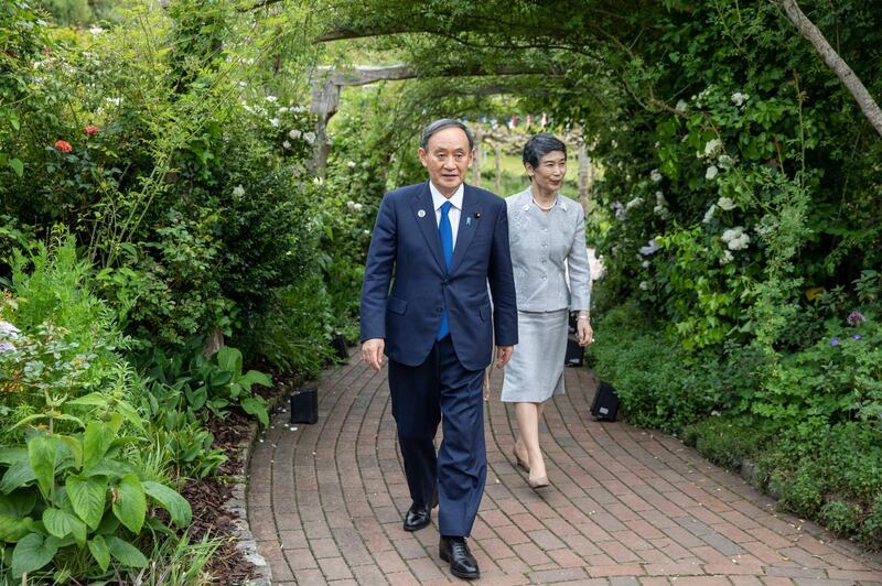 Japanese Prime Minister Yoshihide Suga and wife Mariko Suga attend a reception for the G7 leaders at the Eden Project. AP