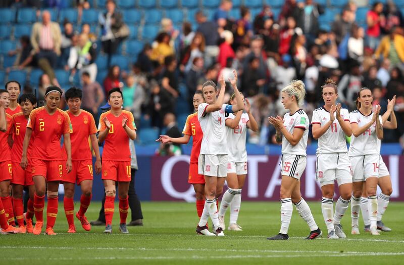 Team Spain, right, and team China applaud at the end of the Women's World Cup Group B soccer match between China and Spain at the Stade Oceane in Le Havre, France, Monday, June 17, 2019. (AP Photo/Francisco Seco)
