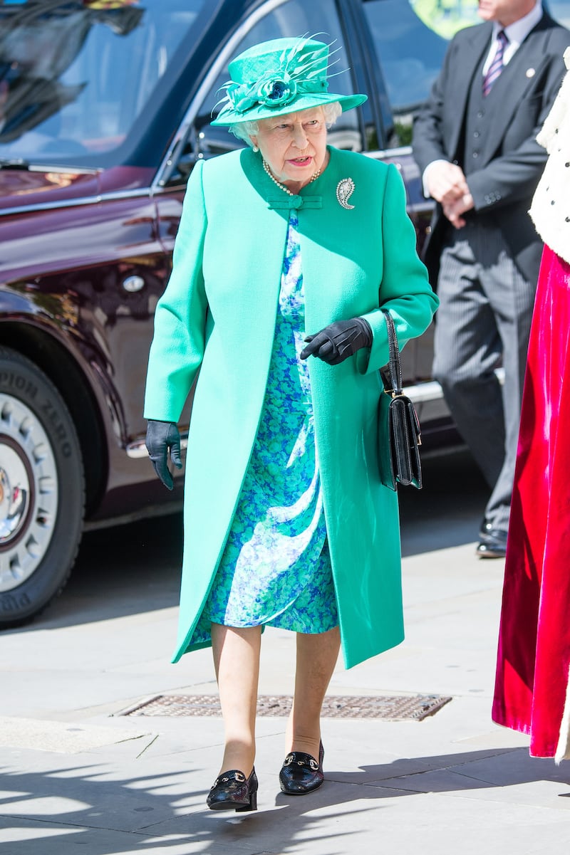 Queen Elizabeth II, wearing green, attends a service to mark the Centenary of the Order of the British Empire at St Paul's Cathedral on May 24, 2017 in London, England. Getty Images