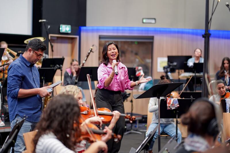 Well-known pop singer Katarina Velarde practices with the orchestra in the studio at Expo City Dubai. She will sing a  Filipino Christmas classic Pasko Na Sinta Ko that tells of love and heartbreak.