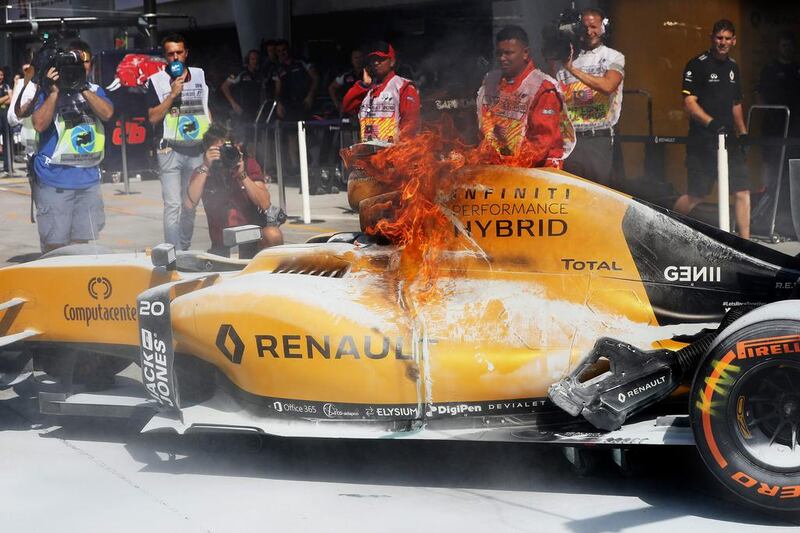 The car of Denmark’s Kevin Magnussen, who drives for Renault Sport F1, burns in the pit during a practice for the Malaysia Formula One Grand Prix at Sepang Circuit on September 30, 2016, in Kuala Lumpur, Malaysia. Mark Thompson / Getty Images