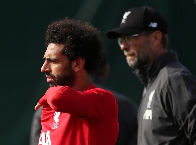 Liverpool manager Jurgen Klopp and Mohamed Salah during training. Reuters