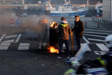 French fishermen block lorries carrying UK-landed fish in protest at the slow issuance of licenses to fish inside British waters, at the fishing port in Boulogne-sur-Mer, France. Reuters