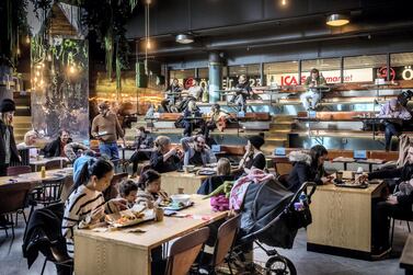 Swedes eat in a food court after the government called for the public to avoid crowds earlier this month. Getty Images