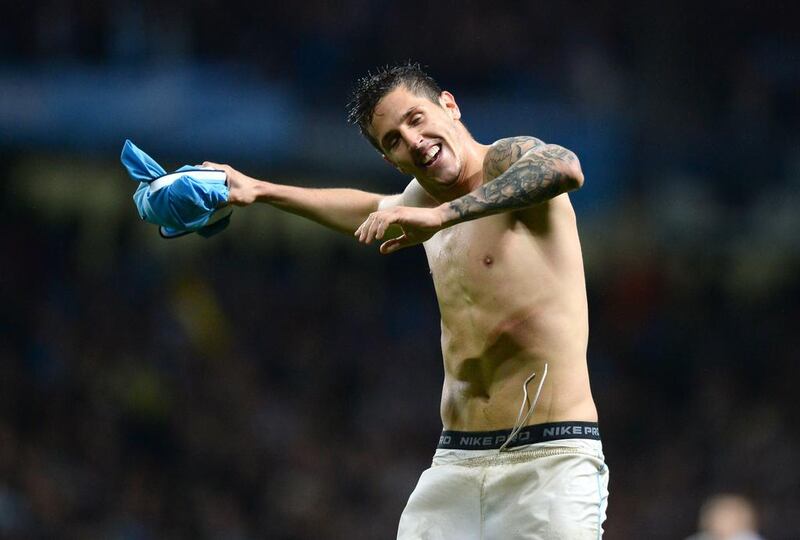 Manchester City striker Stevan Jovetic celebrates scoring his team's third goal against Aston Villa on Wednesday. Andrew Yates / AFP / May 7, 2014