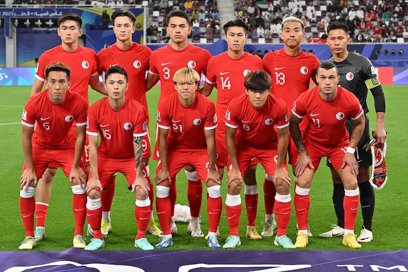 Hong Kong's players pose for a group photograph. AFP