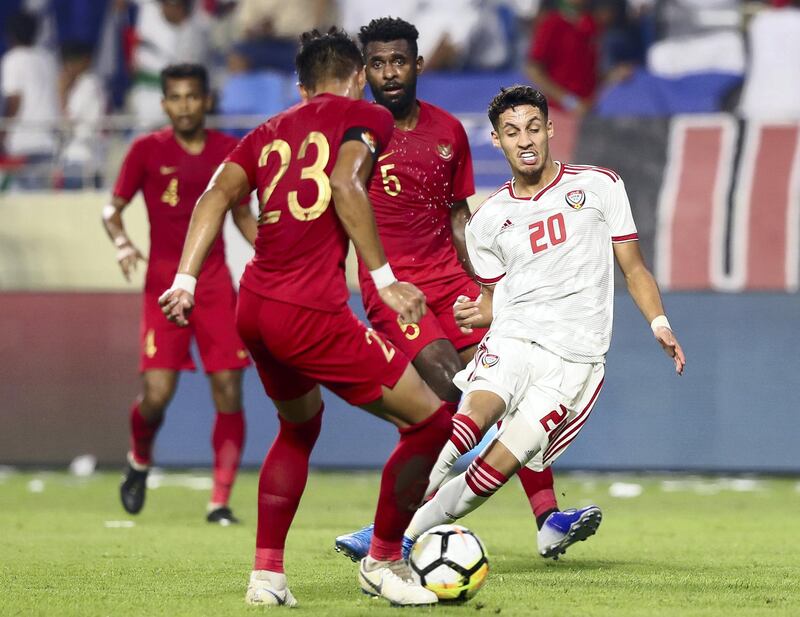 Dubai, United Arab Emirates - October 10, 2019: Ali Saleh of the UAE try to regain the ball during the Qatar 2022 world cup qualifier between The UAE and Indonesia. Thursday 10th of October. Al Maktoum Stadium, Dubai. Chris Whiteoak / The National