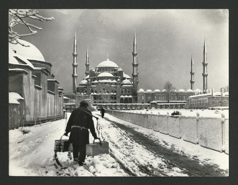 Sultan Ahmed Mosque, street seller in the snow. Taken by Othmar Pferschy, circa 1930