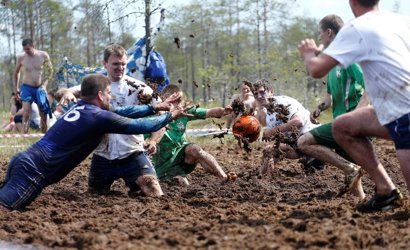 Soccer enthusiasts compete in the Swamp Football Cup of Russia in the village of Pogi in Leningrad Region, Russia June 16, 2018. Anton Vaganov / Reuters